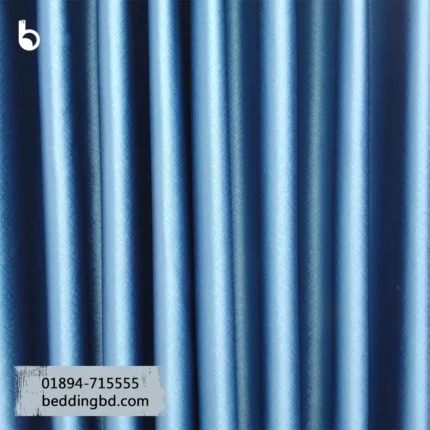 Blackout Curtain - Blue Deep blue blackout curtain enhancing a modern room interior with light control and privacy.