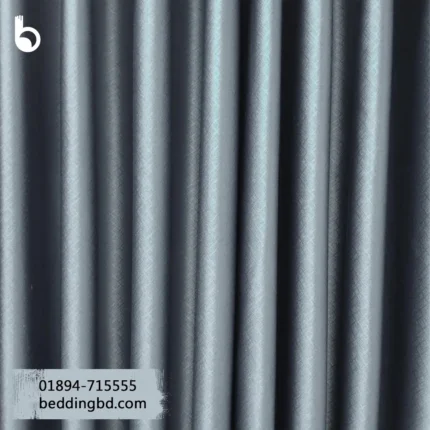 Blackout Curtain - Gray Gray blackout curtain with soft folds hanging in a cozy, stylish room.